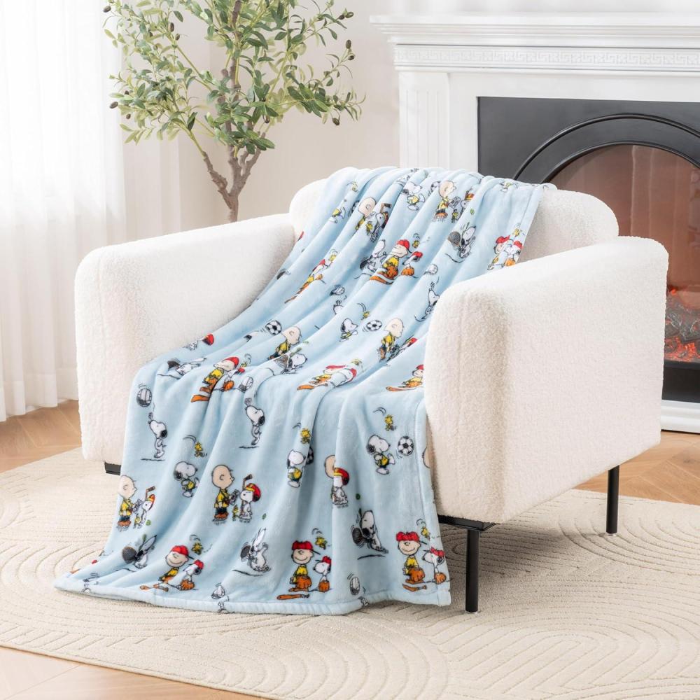 image:imageBerkshire Blanket Peanuts VelvetLoft Cute Character Snoopy Plush Throw BlanketPeanuts Snoopy Make A Wish Spring PinkThrow 55 in x 70 in Official Peanuts ProductSnoopy the Athlete Closed in Blue